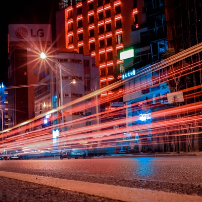 timelapse photography of vehicle near building